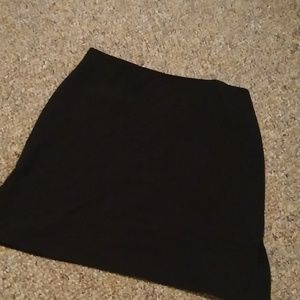 Variety of shirts and a high Waisted black skirt